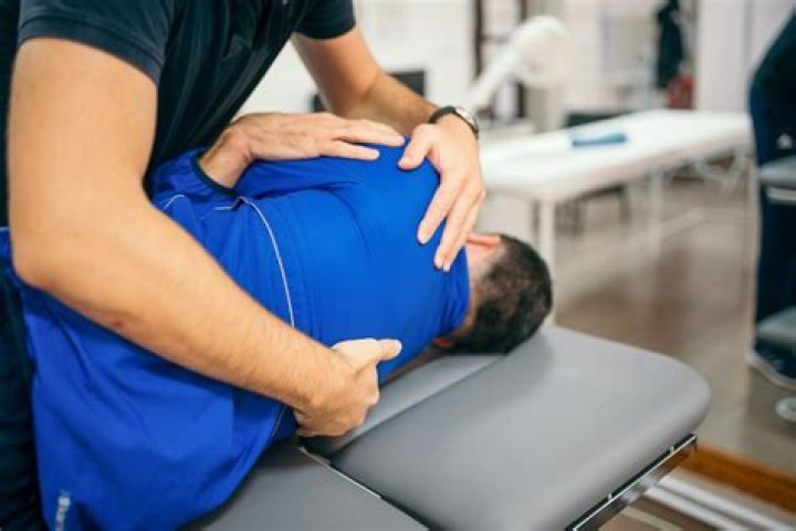 Closeup of a chiropractor adjusting his patient Ivan Radic Flickr