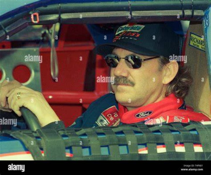 Dale Jarrett on pit road with his wife at Darlington Raceway at the