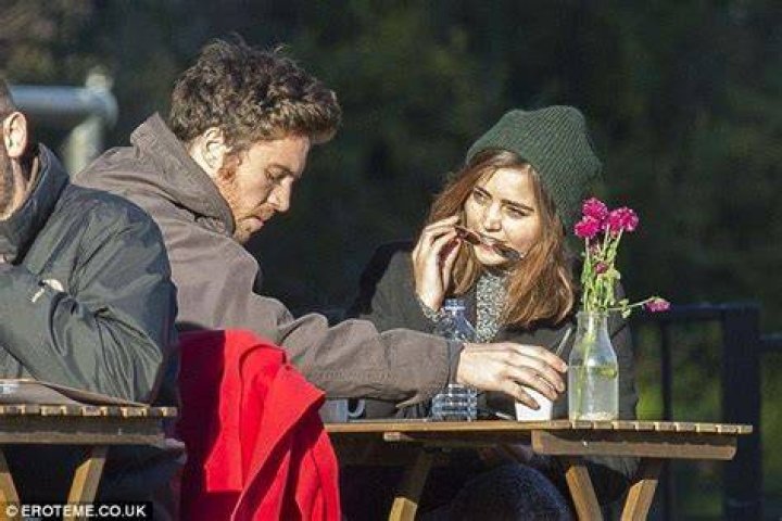 Jenna Coleman is pictured kissing boyfriend Tom Hughes for the first