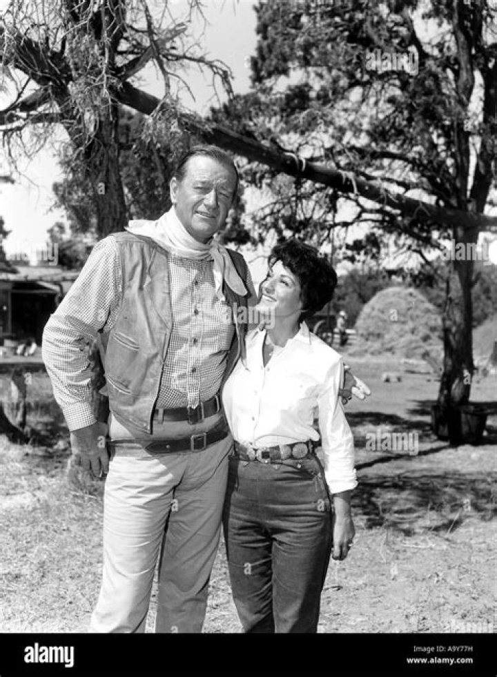 John Wayne with his wife and John Ford 1957 John ford, John wayne