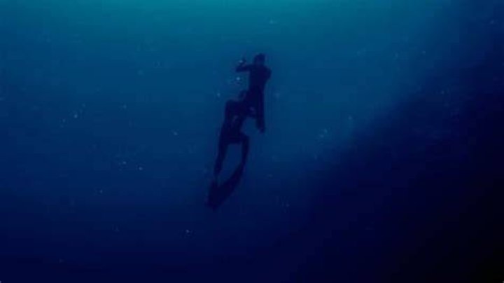 Last image of free diver Stephen Keenan (bottom diver) rescuing Alessia