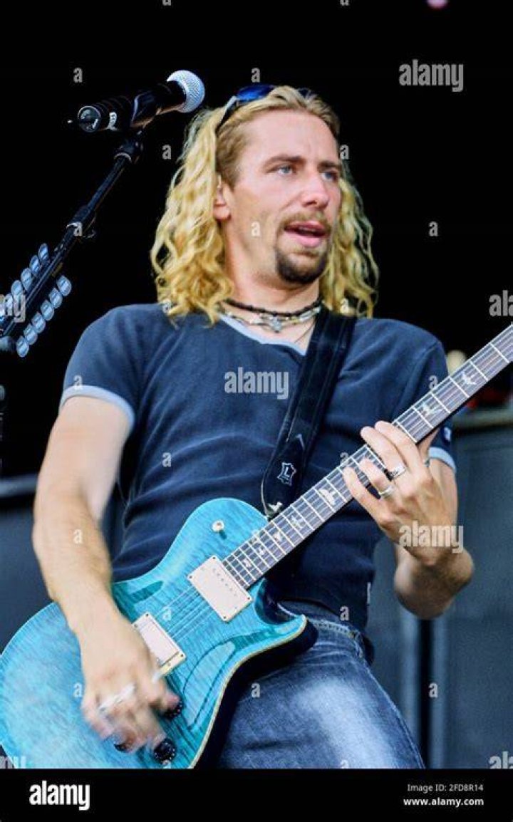 Singer Chad Kroeger of Nickelback and wife Marianne Gurick attend